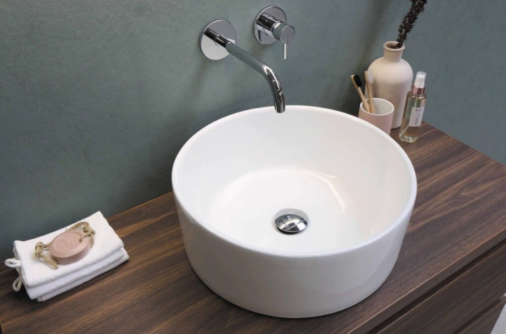 White Ceramic Sink With Stainless Steel Faucet