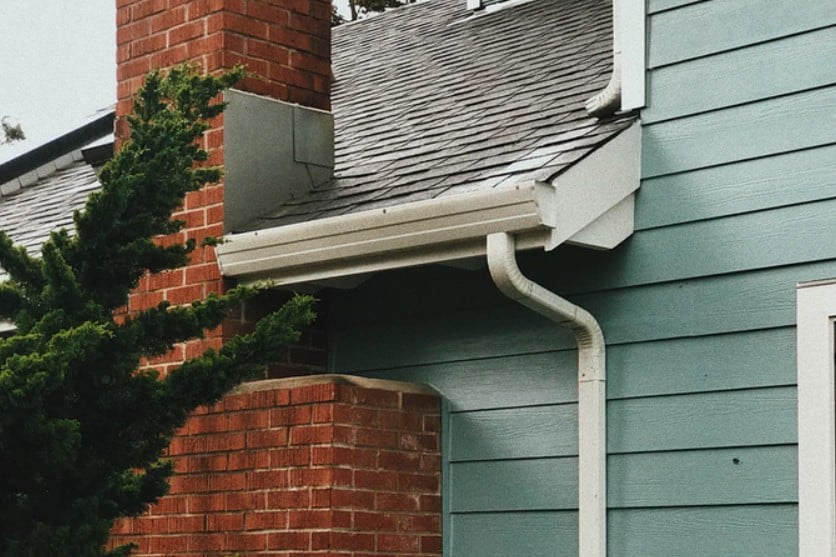 Blue House With White Guttering